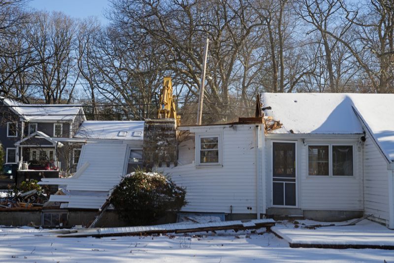 a house with white walls being demolished